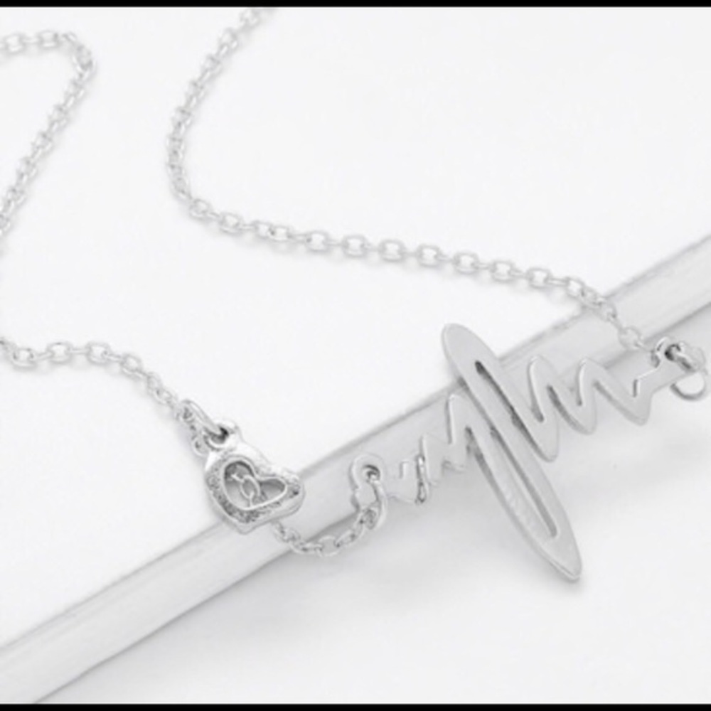 Silver heart beat ekg tracing trendy necklace…